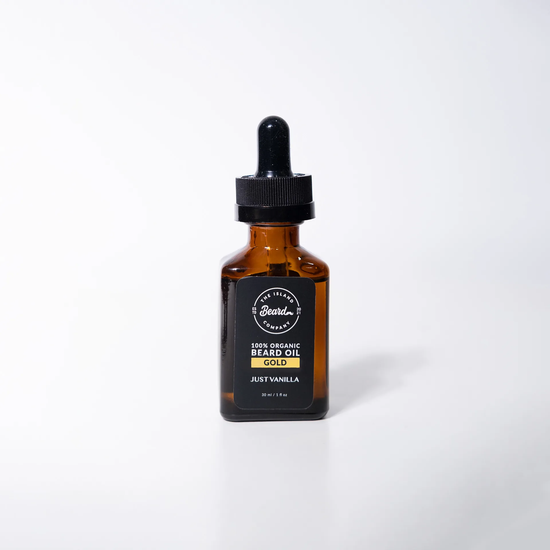 Amber beard oil bottle with black label, first scent