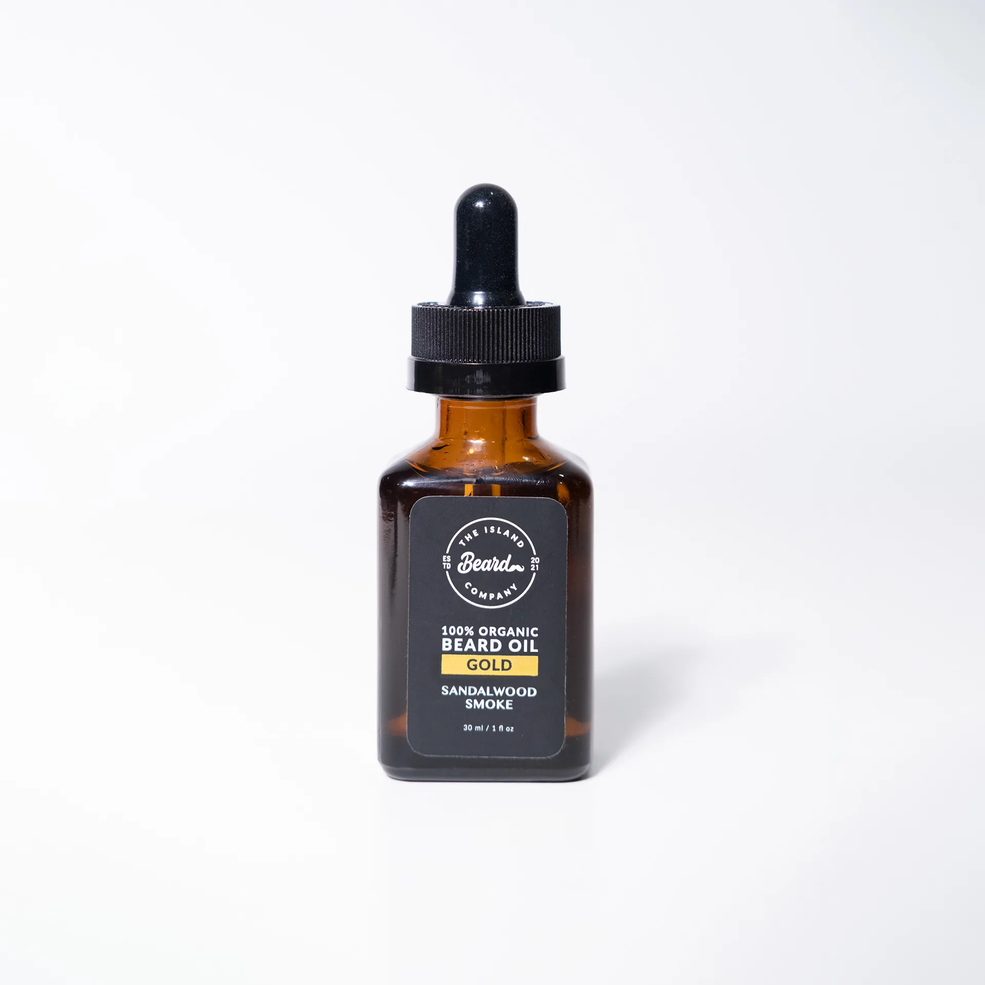 Amber beard oil bottle with black label, second scent