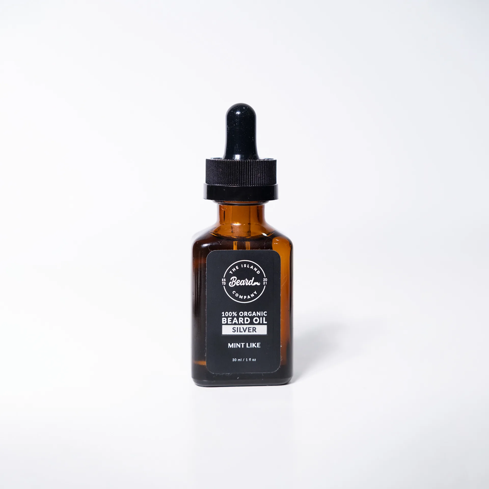 Amber beard oil bottle with black label, third scent