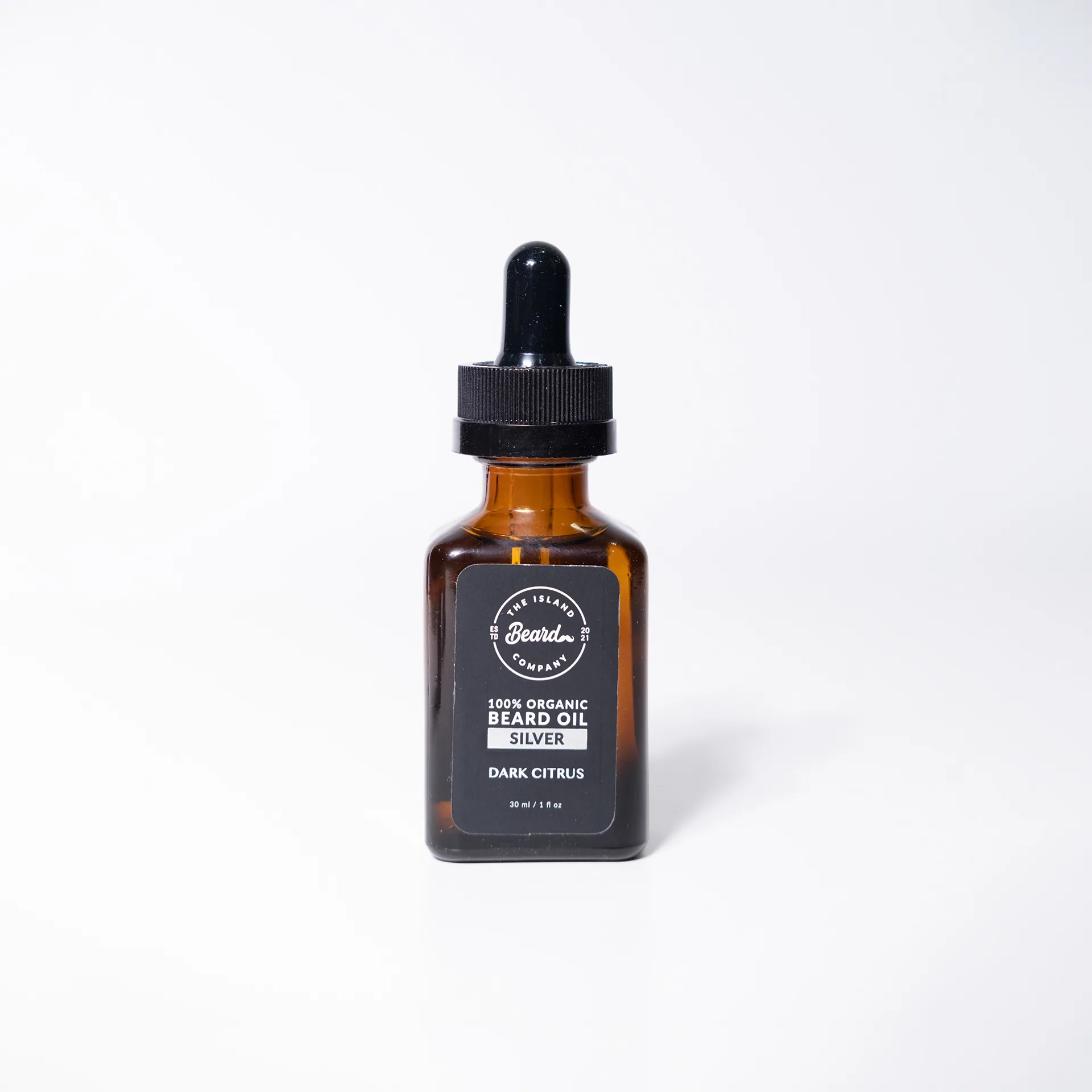 Amber beard oil bottle with black label, fourth scent