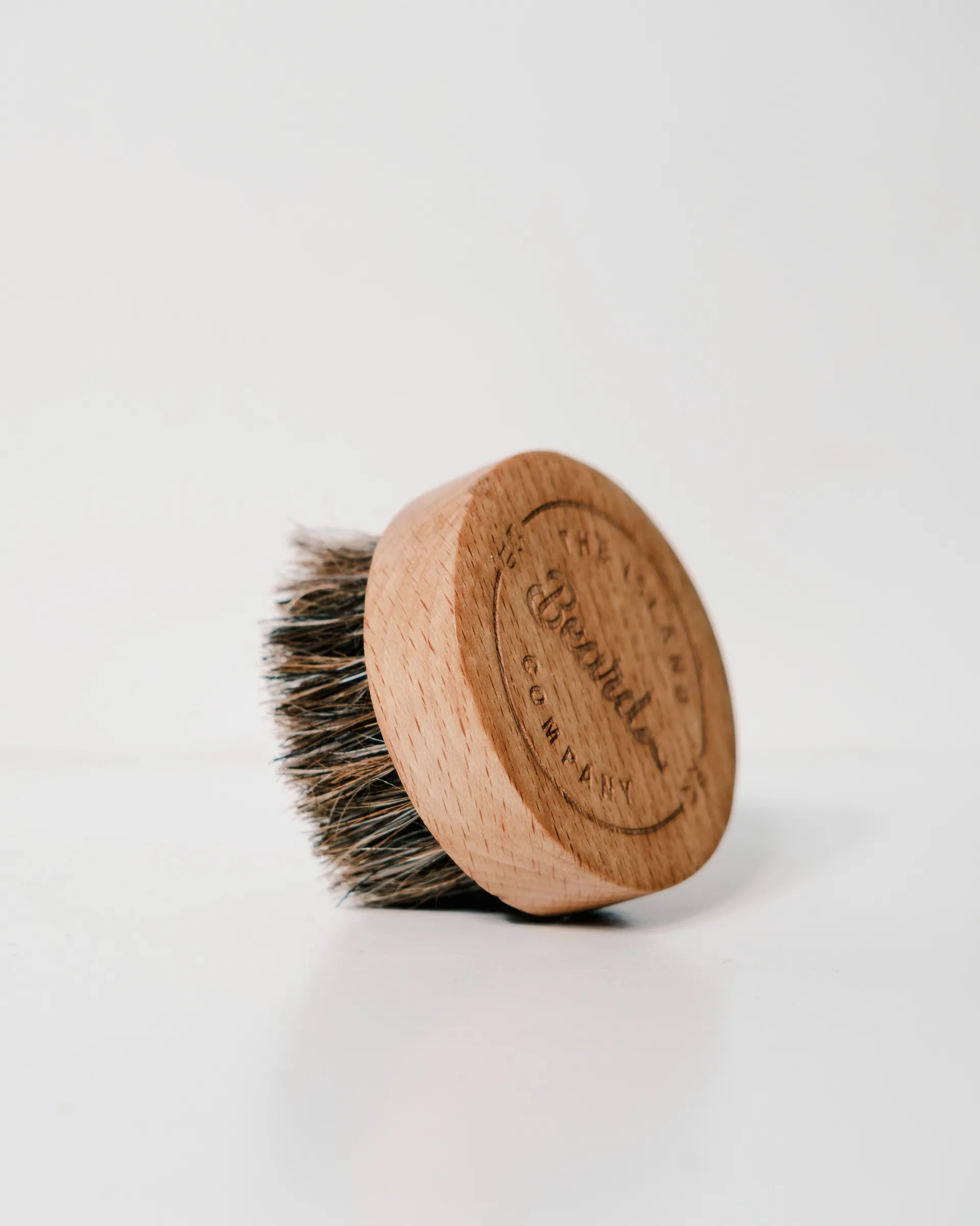 Wooden beard brush with engraved logo