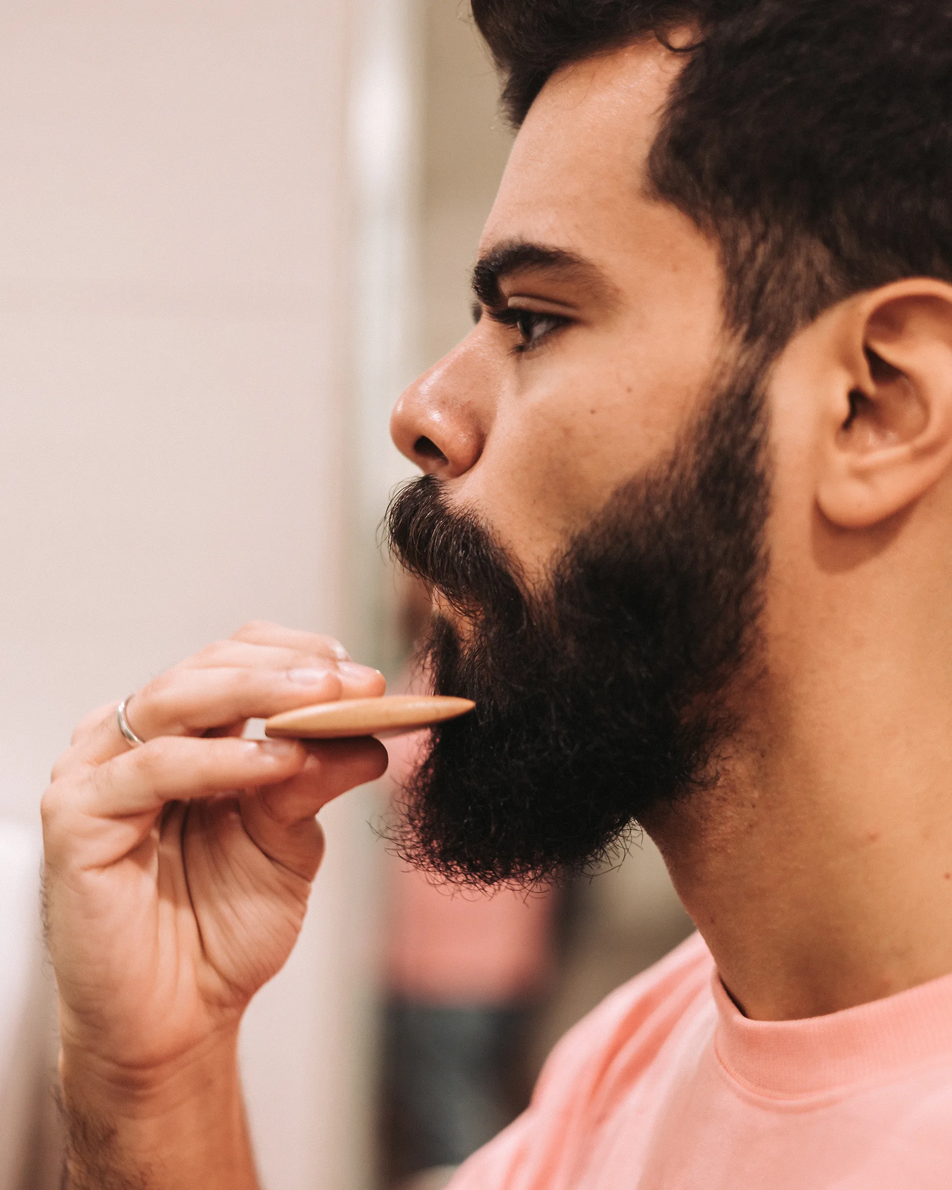 Man combing his beard
